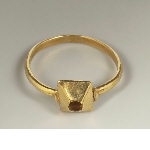 Ring with bezel in shape of truncated pyramid