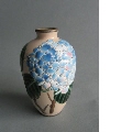 Small vase with blue hydrangea decoration
