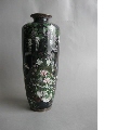 Vase decorated with couple of turtledoves under a wisteria